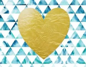 gold heart on a blue and white background