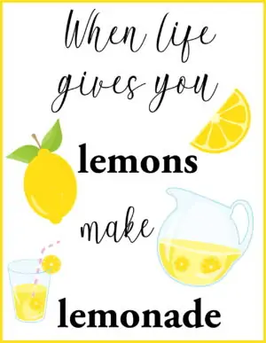 A jug of lemonade with a lemon and a glass of lemonade